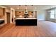Modern kitchen with an island with seating and lighting, lots of cabinet space at 300 Eminence Peak, Rydal, GA 30171