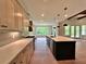 Bright, modern kitchen with quartz countertops, stainless steel appliances, and large island at 300 Eminence Peak, Rydal, GA 30171