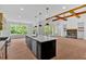 Bright, open-concept living area, connecting the kitchen, dining, and Gathering rooms at 300 Eminence Peak, Rydal, GA 30171