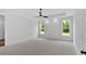 Large Main bedroom with tray ceiling, ceiling fan, and carpeted floors at 300 Eminence Peak, Rydal, GA 30171
