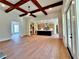 Spacious open concept view of living room and kitchen, featuring hardwood floors and natural light at 300 Eminence Peak, Rydal, GA 30171