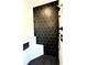Close-up of the tiled walk-in shower with matte black hardware and a built-in bench at 300 Eminence Peak, Rydal, GA 30171