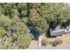 An aerial view of houses surrounded by lots of trees and greenery in a suburban neighborhood at 4092 Deerbrook Sw Way, Lilburn, GA 30047