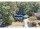 Two-story suburban home with a welcoming front porch and garage, nestled among mature trees in a friendly neighborhood at 4092 Deerbrook Sw Way, Lilburn, GA 30047