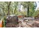 Outdoor deck shaded by trees, perfect for relaxed seating and peaceful backyard enjoyment at 4092 Deerbrook Sw Way, Lilburn, GA 30047