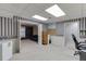 Finished basement with additional area, storage, neutral carpet and decorative wallpaper at 4092 Deerbrook Sw Way, Lilburn, GA 30047