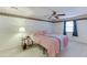 Bedroom featuring carpet, single window, and decorative elements at 4092 Deerbrook Sw Way, Lilburn, GA 30047