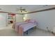 Cozy bedroom with carpet, ceiling fan, and direct access to an ensuite bathroom with a vanity at 4092 Deerbrook Sw Way, Lilburn, GA 30047