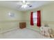 Neutral bedroom featuring carpet, single window, and decorative elements at 4092 Deerbrook Sw Way, Lilburn, GA 30047