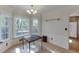 Cozy dining area with tile floors, decorative wallpaper, and view to a deck at 4092 Deerbrook Sw Way, Lilburn, GA 30047