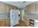 Well-equipped kitchen with stainless steel appliances and beautiful wood cabinetry at 4092 Deerbrook Sw Way, Lilburn, GA 30047