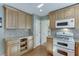 A traditional kitchen with stainless steel appliances and granite countertops at 4092 Deerbrook Sw Way, Lilburn, GA 30047