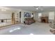 Spacious living room featuring neutral carpet, ceiling fan, and windows providing natural light at 4092 Deerbrook Sw Way, Lilburn, GA 30047