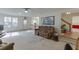 Spacious living room with white walls, fireplace, and multiple windows for natural light at 4092 Deerbrook Sw Way, Lilburn, GA 30047