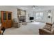 Cozy living room with stone fireplace, wood paneling, and comfortable seating area at 4092 Deerbrook Sw Way, Lilburn, GA 30047