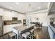 Stylish kitchen with a granite island, stainless appliances, and views to the dining area at 5775 Stellata Cir, Cumming, GA 30028