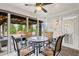 Covered outdoor patio featuring stylish seating and views of the landscaped backyard at 5775 Stellata Cir, Cumming, GA 30028