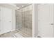 Modern bathroom featuring a glass enclosed shower with stone tile at 5775 Stellata Cir, Cumming, GA 30028