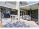 Inviting outdoor space featuring a covered deck with built-in grill, beverage fridge, and a cozy swing, perfect for entertaining at 630 Silverberry Ln, Sugar Hill, GA 30518