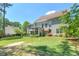 This backyard features a putting green, sand trap and partially covered deck that's perfect for outdoor enjoyment at 630 Silverberry Ln, Sugar Hill, GA 30518