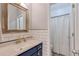 Bathroom featuring a white vanity, modern fixtures, subway tile, and a separate shower area at 630 Silverberry Ln, Sugar Hill, GA 30518
