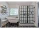Stylish bathroom with freestanding tub, modern shower, hexagon tile, and shiplap walls at 630 Silverberry Ln, Sugar Hill, GA 30518