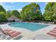 Large community pool with ample seating and lounge chairs, perfect for relaxing and enjoying sunny days at 630 Silverberry Ln, Sugar Hill, GA 30518