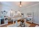 Bright craft room with wine cooler, desk, and storage solutions perfect for creative projects and organization at 630 Silverberry Ln, Sugar Hill, GA 30518