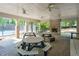 Covered outdoor pavilion with picnic tables and a brick fireplace, adjacent to the tennis courts, perfect for gatherings at 630 Silverberry Ln, Sugar Hill, GA 30518