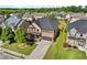 Beautiful aerial view of a well-maintained home with a manicured lawn and neighborhood at 1212 Overlook Lake Dr, Dacula, GA 30019