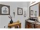 Charming powder room featuring a decorative vanity, elegant mirror, and tasteful wall art at 1212 Overlook Lake Dr, Dacula, GA 30019