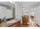 Bright bathroom featuring double vanity and updated fixtures at 1212 Overlook Lake Dr, Dacula, GA 30019
