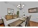 Dining room featuring a large table, elegant decor, and an open layout at 1212 Overlook Lake Dr, Dacula, GA 30019