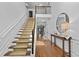 Grand foyer with hardwood floors, elegant staircase, and ample natural light at 1212 Overlook Lake Dr, Dacula, GA 30019