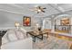 An inviting living room features a fireplace, hardwood floors, and cozy seating at 1212 Overlook Lake Dr, Dacula, GA 30019