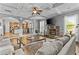 A stylish living room with a fireplace, coffered ceiling and hardwood floors throughout at 1212 Overlook Lake Dr, Dacula, GA 30019