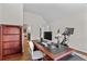 Office featuring wood floors, desk and peloton at 1212 Overlook Lake Dr, Dacula, GA 30019