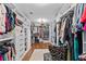 Large walk-in closet with custom organization, shelving, drawers, and ample storage at 1212 Overlook Lake Dr, Dacula, GA 30019