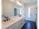 This bathroom offers a dual sink vanity, matte black hardware, and stylish finishes at 1415 Coretta Bnd, Atlanta, GA 30318