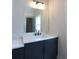 Bathroom vanity features dark wood cabinets and modern faucet at 1415 Coretta Bnd, Atlanta, GA 30318