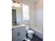 Stylish bathroom featuring a vanity, toilet, tub, and subway tile walls at 1415 Coretta Bnd, Atlanta, GA 30318