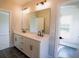 Elegant bathroom features a double vanity with sleek fixtures and modern finishes at 1415 Coretta Bnd, Atlanta, GA 30318