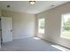 Comfortable bedroom features soft carpet, neutral walls, and plenty of natural light at 1415 Coretta Bnd, Atlanta, GA 30318