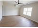 Neutral bedroom with hardwood floors and vaulted ceiling features a ceiling fan and a window at 1415 Coretta Bnd, Atlanta, GA 30318
