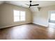 Bright bedroom features a ceiling fan, hardwood floors and a vaulted ceiling at 1415 Coretta Bnd, Atlanta, GA 30318