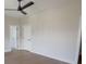 Spacious bedroom features hardwood floors, ceiling fan and neutral walls at 1415 Coretta Bnd, Atlanta, GA 30318