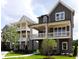 Charming new construction townhouse with inviting double porches and well-manicured landscaping at 1415 Coretta Bnd, Atlanta, GA 30318