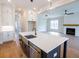 Bright kitchen boasts a center island, open to living area with fireplace at 1415 Coretta Bnd, Atlanta, GA 30318
