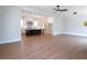 Open-concept living area featuring hardwood floors and seamless flow to kitchen at 1415 Coretta Bnd, Atlanta, GA 30318
