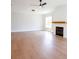 Spacious living room with hardwood floors and a cozy fireplace at 1415 Coretta Bnd, Atlanta, GA 30318
